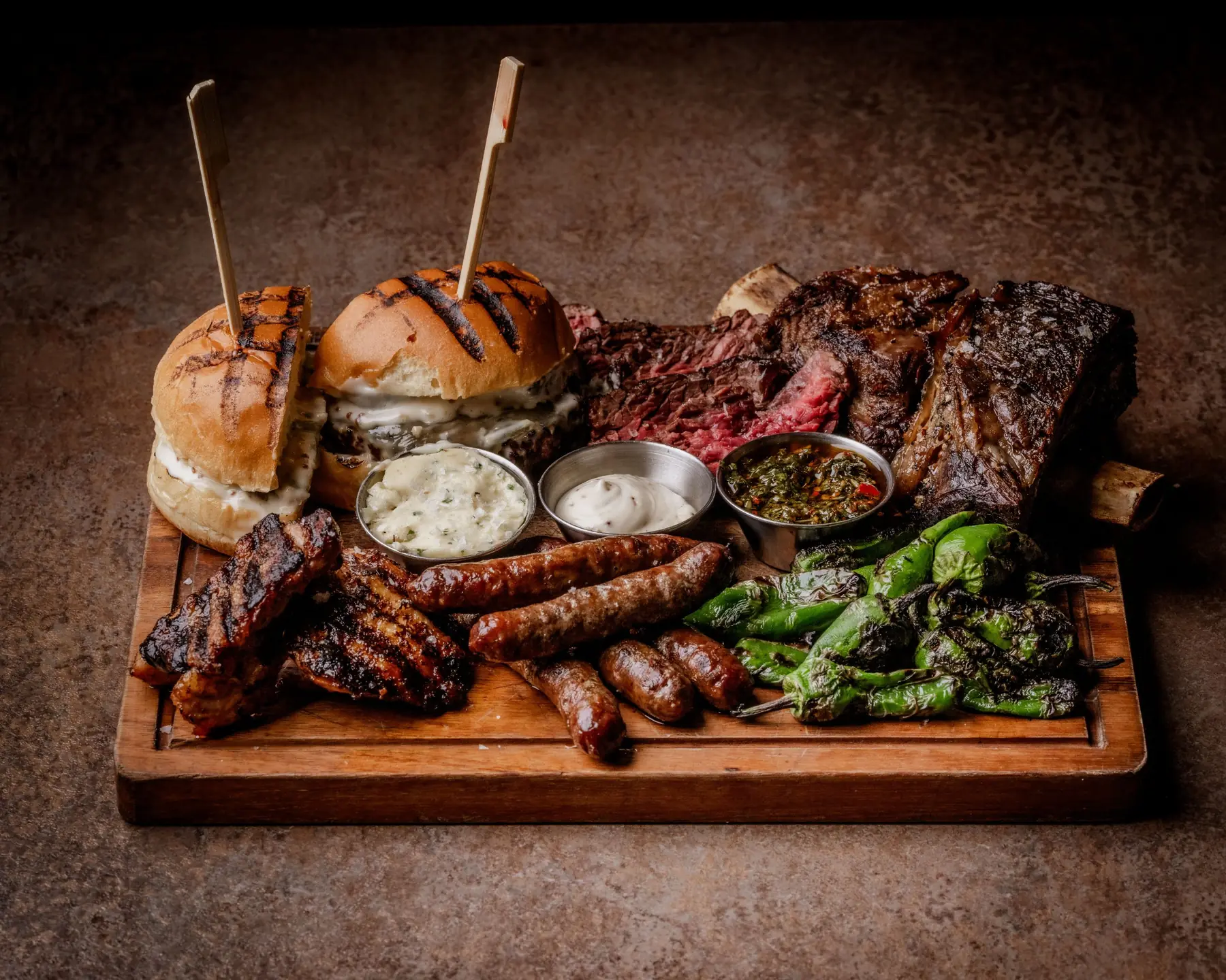 The BRIX Board — cheeseburgers, short rib, bavette, merguez, pork belly, padrón peppers and chimichurri