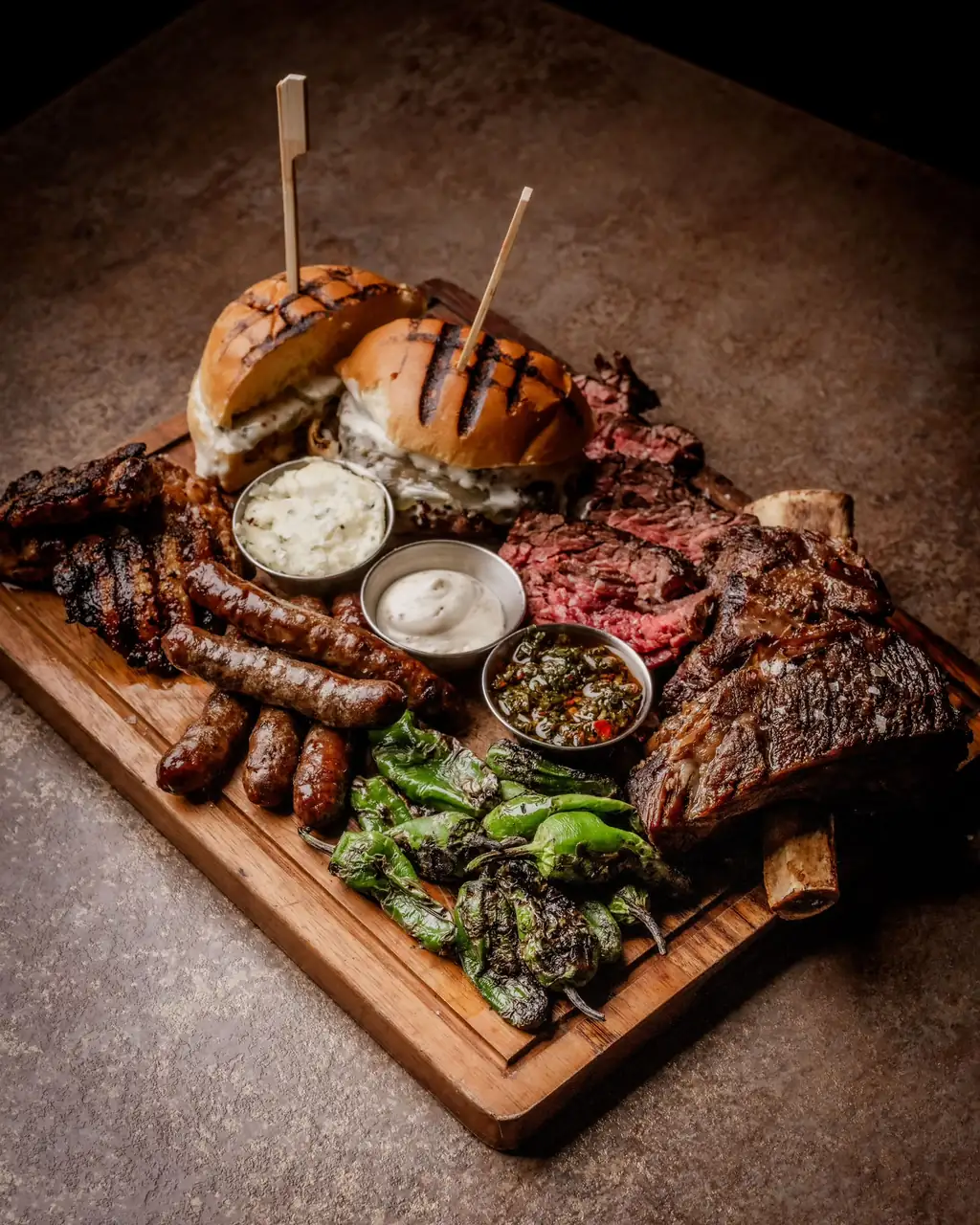 The BRIX Board — short rib, bavette, merguez, padrón peppers, chimichurri and a dry-aged cheeseburger