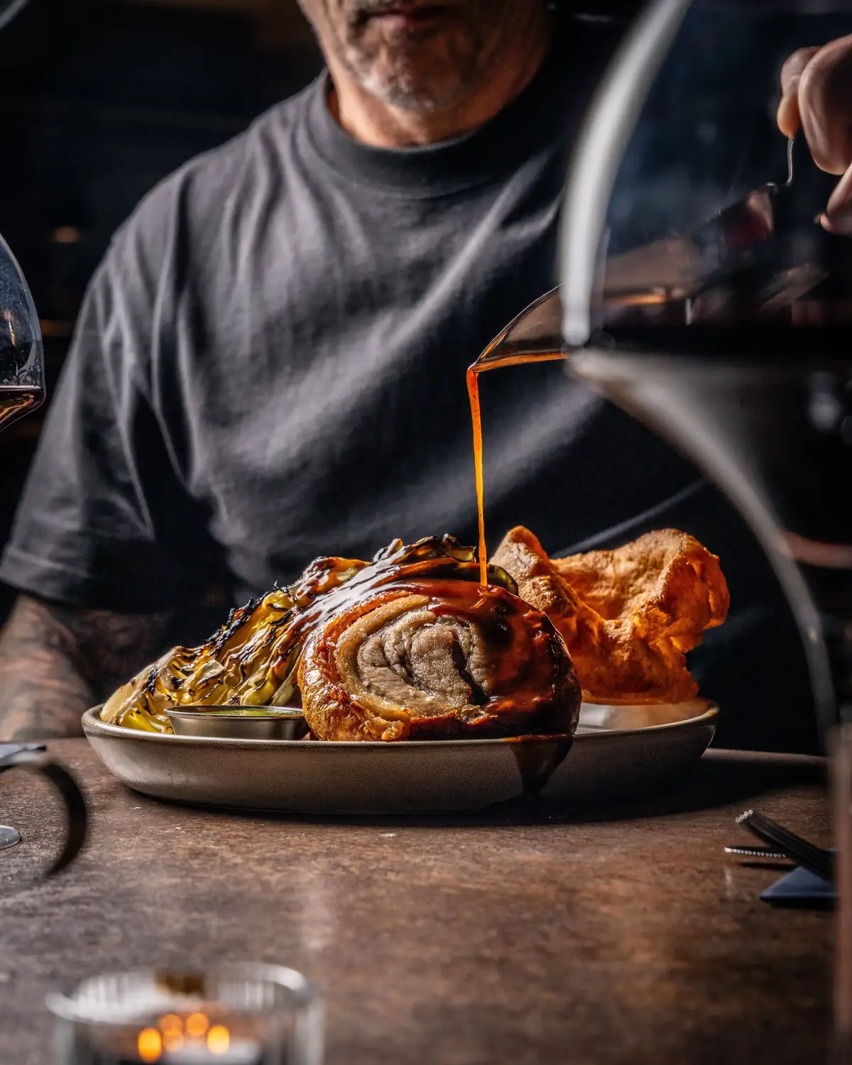 Honey-roast pork belly Sunday roast with a gravy pour