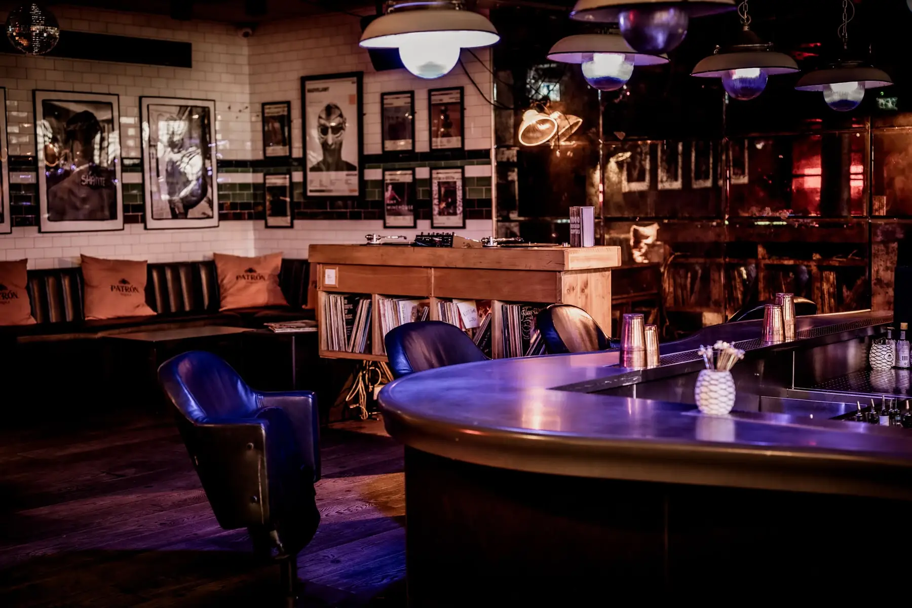 SIXT33N — the decks, a record crate and the curved bar